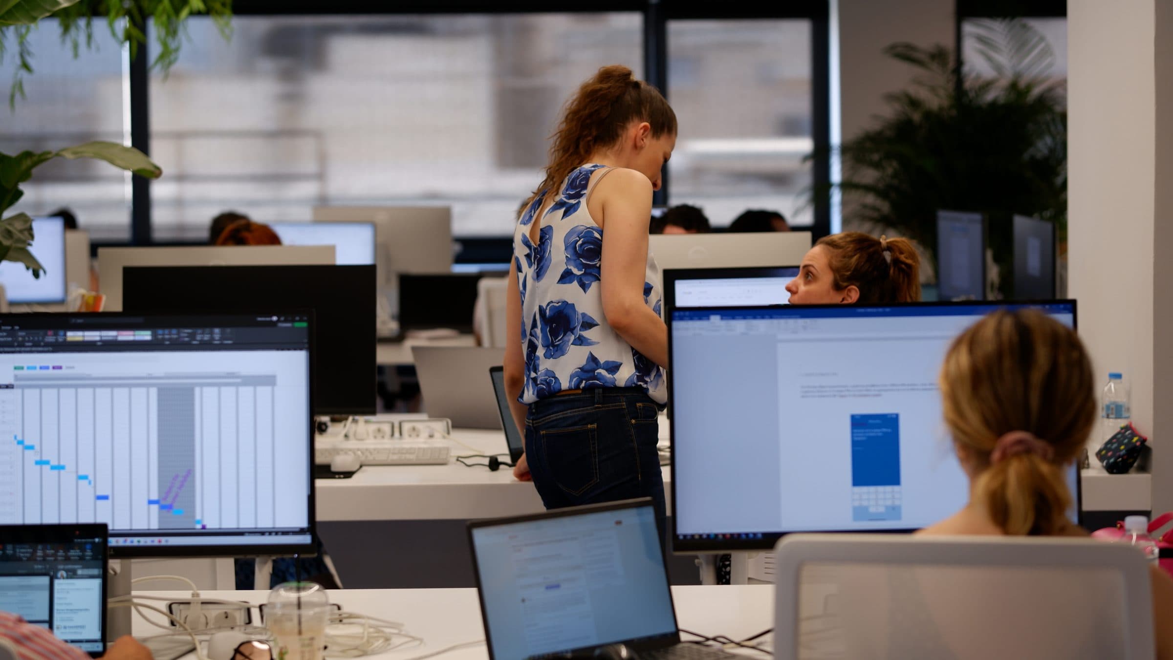 The ATCOM team at work across the open-plan office